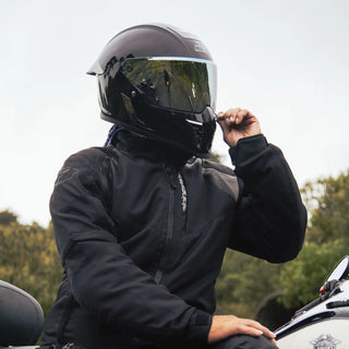 woman-posing-outdoors-wearing-hax-black-gloss-full-face-helmet