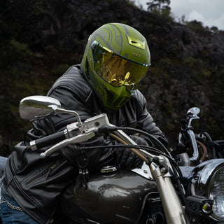 motorcycle-rider-wearing-hax-black-pearl-master-green-full-face-helmet-on-cruiser-bike-in-mountain-road