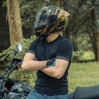 rider-leaning-on-motorcycle-wearing-hax-onix-rapha-full-face-helmet